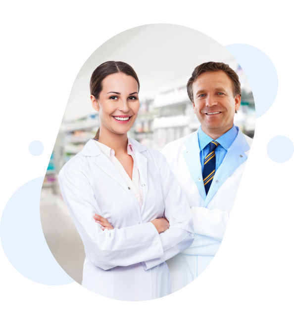 Smiling medical professionals in white lab coats standing in a modern laboratory or medical facility